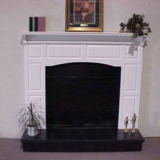 Raised Panel Surround With Raised Black Tile Hearth